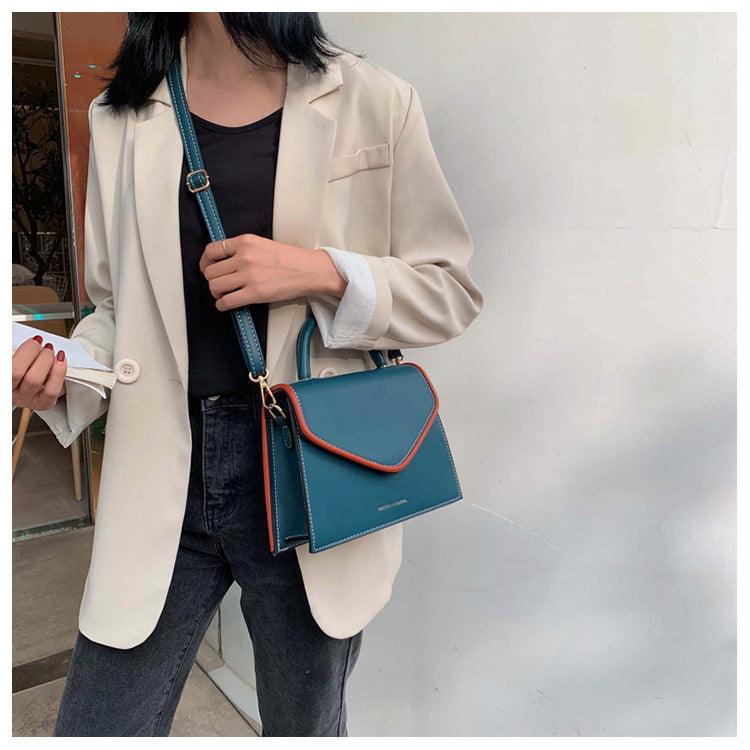 Kompakte Crossbody-Schultertasche in Khaki, Blau, Schwarz oder Orange – praktisch für den Alltag.