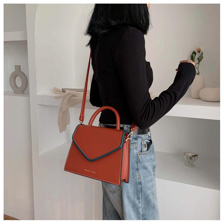 Kompakte Crossbody-Schultertasche in Khaki, Blau, Schwarz oder Orange – praktisch für den Alltag.