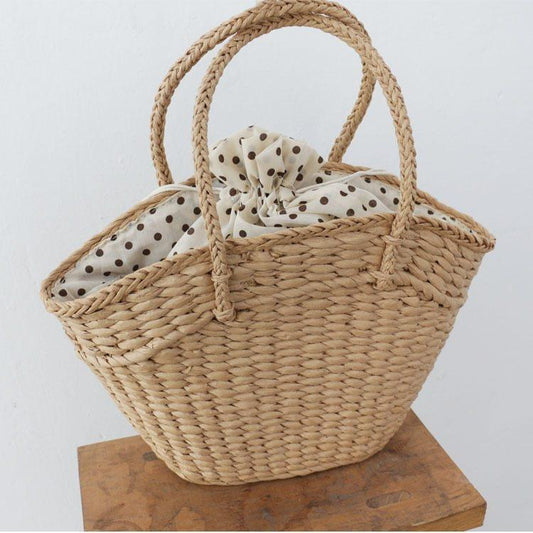 Rattan Handtasche in Khaki und Beige, mit weichen Tragegriffen und grossem Stauraum – ideal für den Alltag.