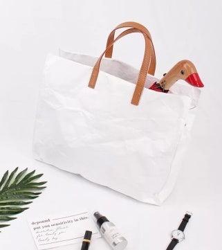 Stilvolle Eco-Papierhandtasche aus Dupont-Papier und Canvas, robust und umweltfreundlich, ideal für den Alltag.