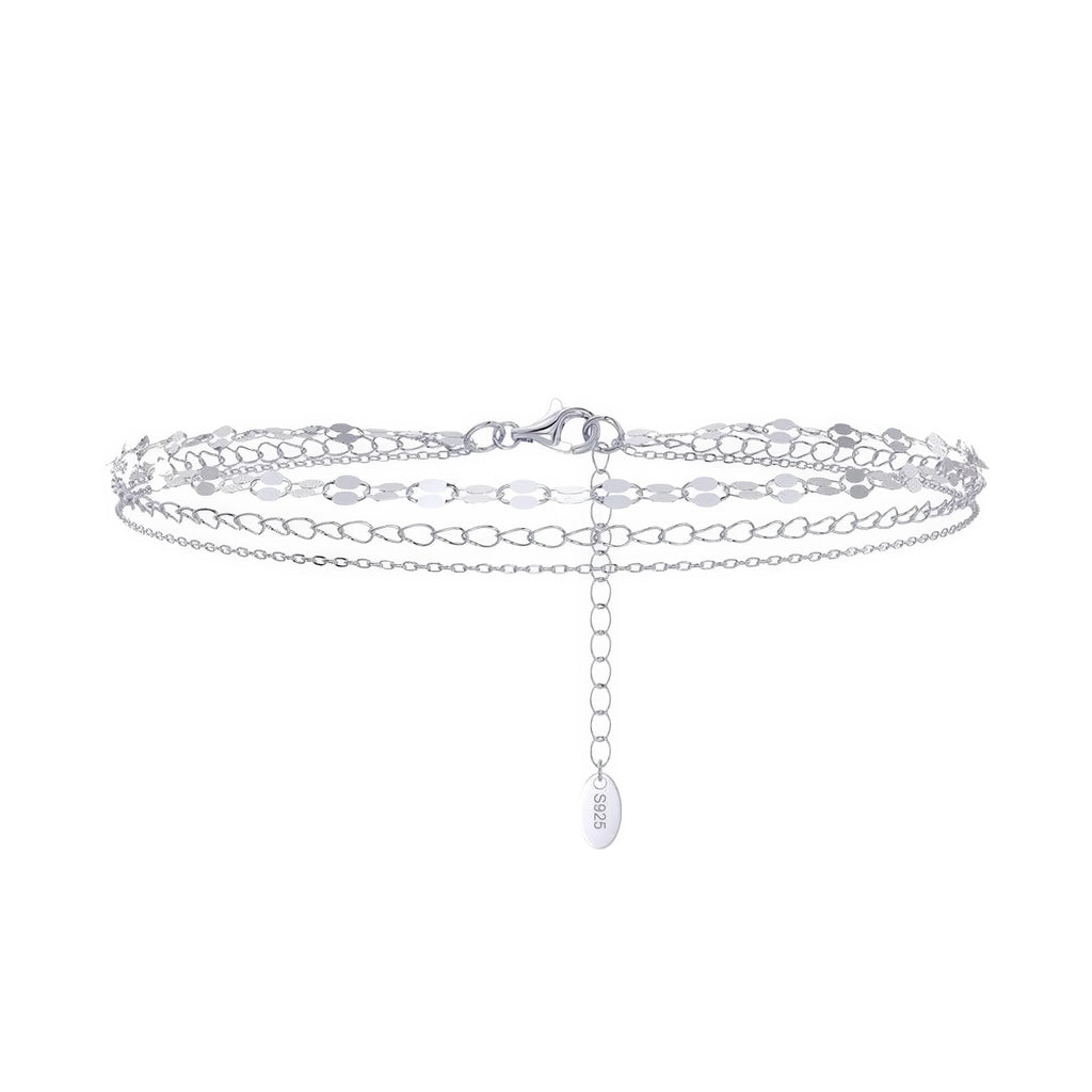 technische fusskette silber doppelt geführt – ruhig, flach, strukturell, ohne ausdruck