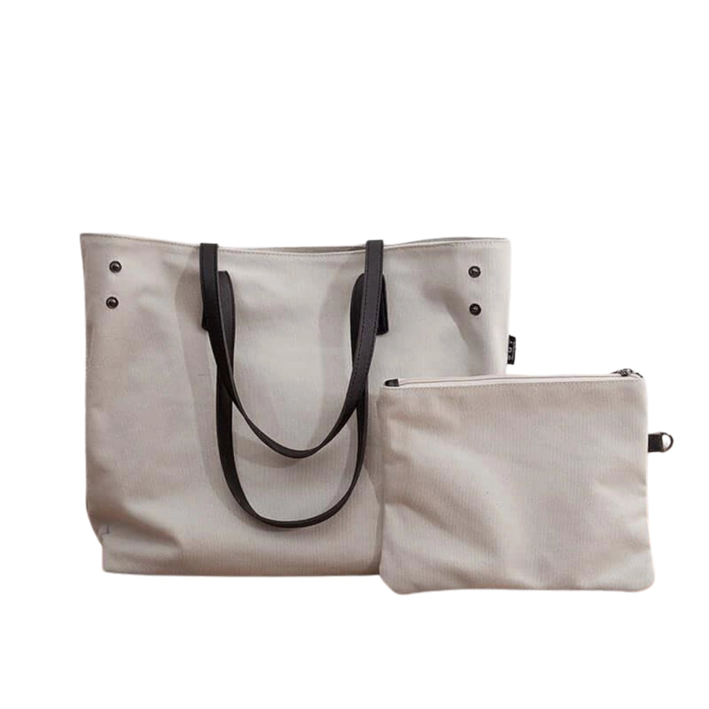 Beiger Canvas-Shopper mit schwarzen Henkeln und passendem Innenetui im Set – schlicht, leise, organisiert