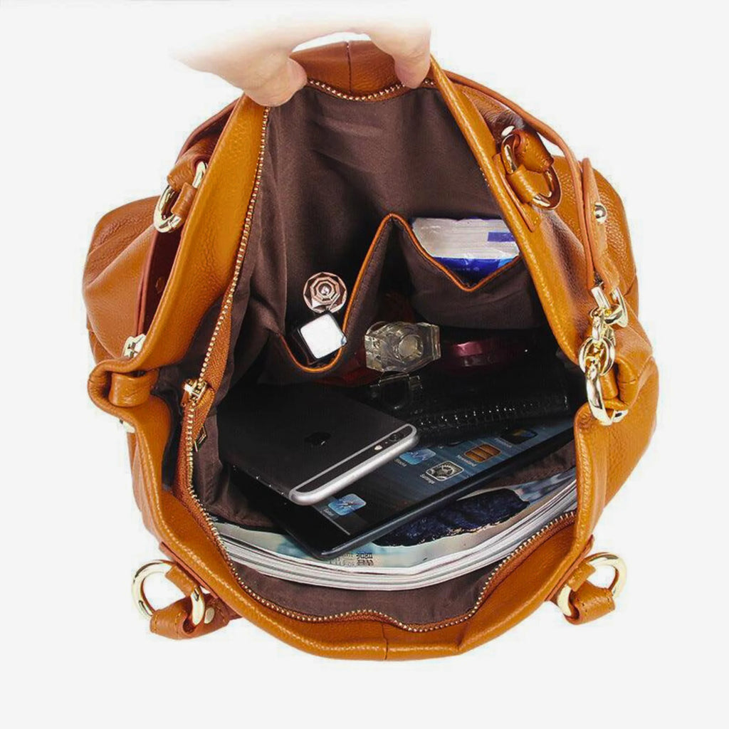 Innenansicht der Tasche mit Zipperfach, Handyfach, Notizbuch und Kosmetik – organisiert und alltagstauglich