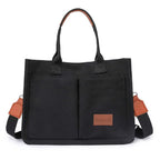 Schwarze Canvas Tasche mit braunen Akzenten und grossem Stauraum