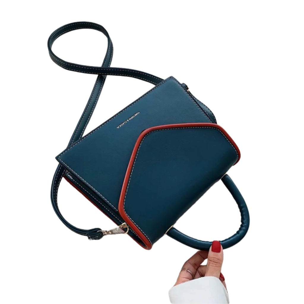 Blaues PU-Crossbody-Bag mit markanter roter Kontrastkante und feinem Griff – strukturiert und modern