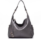 Graue Schultertasche aus echtem Leder – elegante Form mit stabiler Tragefläche und Reissverschluss