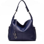 Dunkelblaue Echtledertasche – Schulterriemen, elegante Form, strukturierte Oberfläche