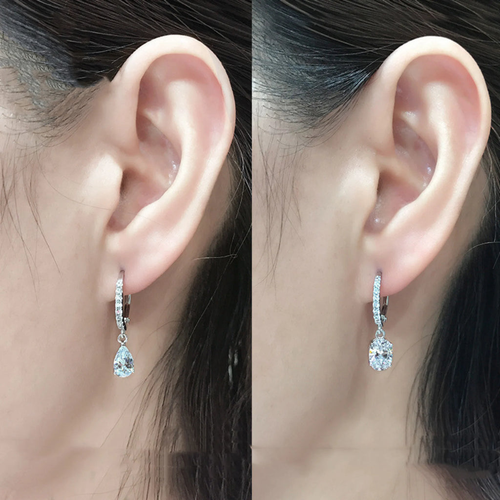 Ohrhänger mit Kristalltropfen in klarer Fassung, silberfarben getragen