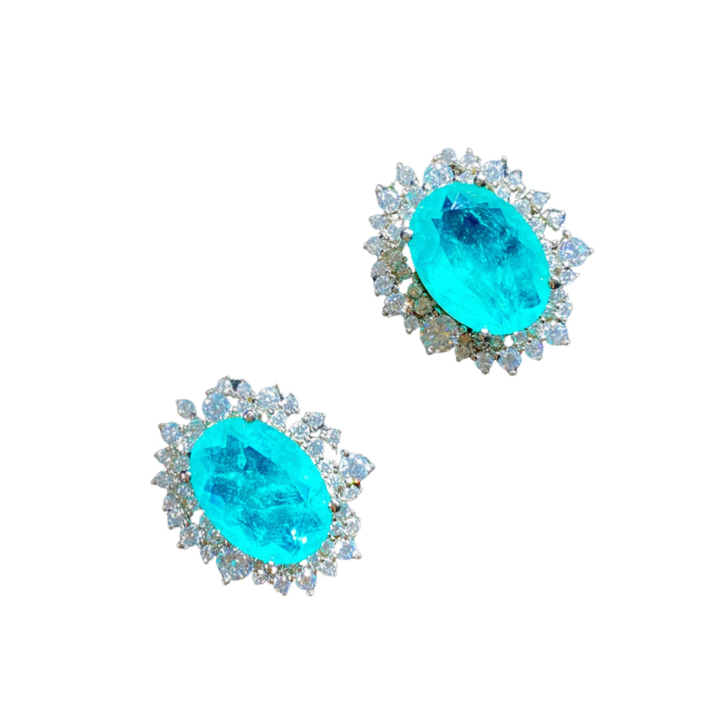 Zwei oval geschliffene Paraiba-Steine mit Zirkoniakante – frontal dargestellt.