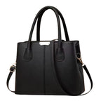 Kompakte schwarze Schultertasche – zeitloses Design mit Strukturgriff, Reissverschluss und Innentaschen