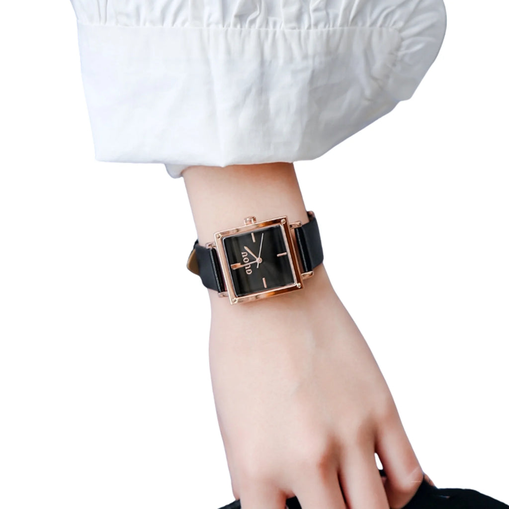 Uhr mit schwarzem Band und roségoldenem Rahmen, minimalistisches Zifferblatt