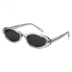 Rechteckige Sonnenbrille mit roten Gläsern und goldfarbenem Titanrahmen