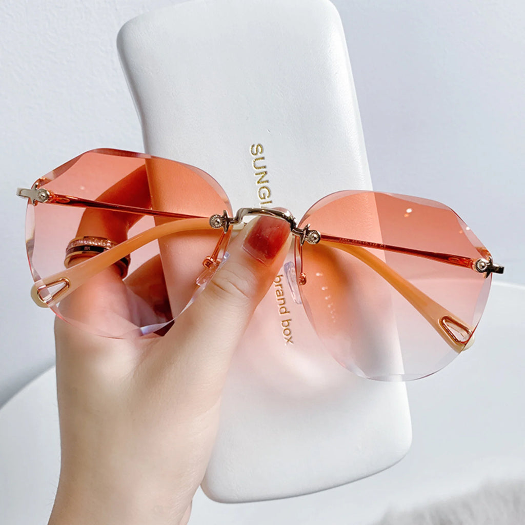 Sonnenbrille mit Goldrahmen und orangefarbenem Verlauf – offen gefasst, UV400 geprüft