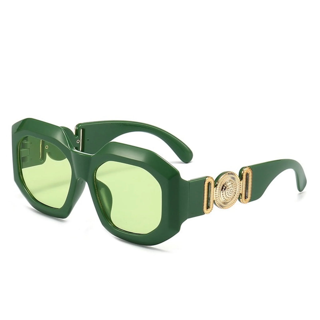Grüne Sonnenbrille mit hellgrünen Gläsern und Goldornament – frontal