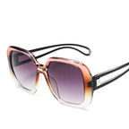 Sonnenbrille mit Apricot-Braun-Verlauf in transparenter Oversize-Optik