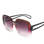 Grosse Verlaufssonnenbrille in Rosa-Braun mit klarer Randlinie