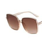 Leicht getönte braune Sonnenbrille mit ruhiger Fläche und transparenter Fassung