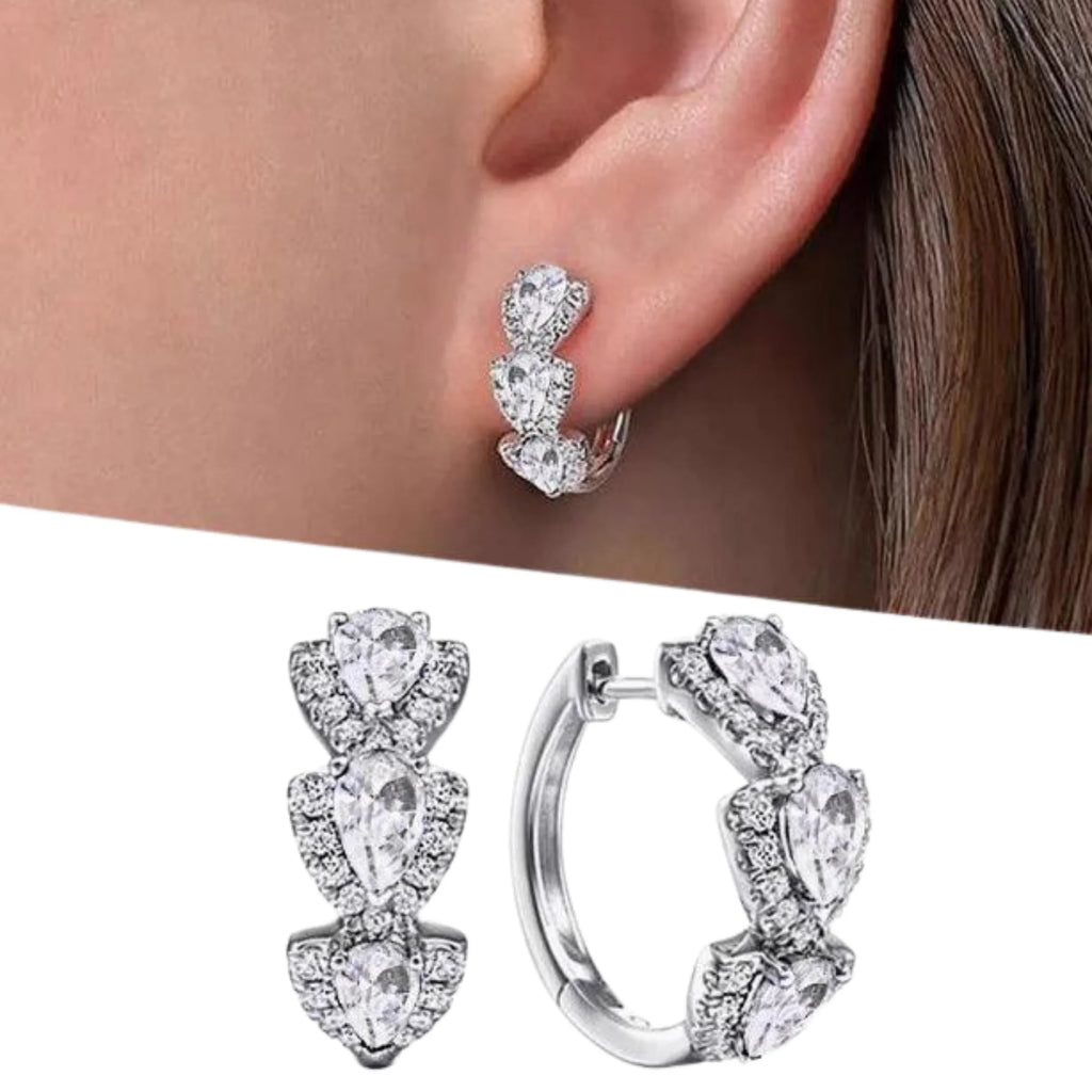 Silberne Creolen mit weissen Zirkonia-Tropfen – getragen und parallel gezeigt