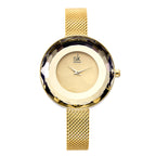 Runde Uhr mit goldfarbenem Meshband und facettiertem Gehäuse