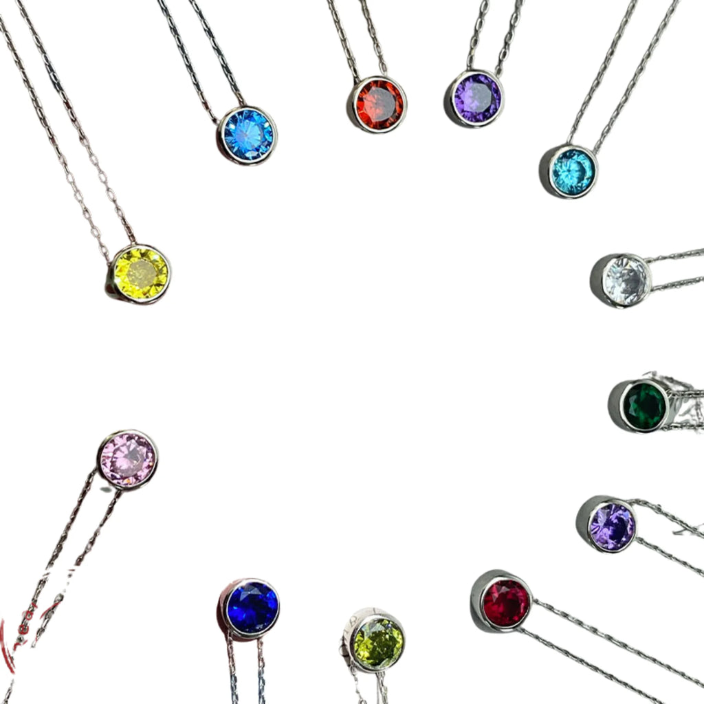 Alle 12 Monatsfarben der Zirkonia-Kette im Kreis – runde Anhänger in farblicher Übersicht